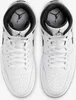 A top-down view of a pair of white Nike Air Jordan 1 Mid sneakers. Anteprima dell’immagine prodotto