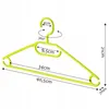 A green plastic clothes hanger with measurements indicated. It's shown against a white background. Anteprima dell’immagine prodotto