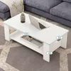 A white coffee table with a laptop and a vase on it, placed in a living room setting next to a sofa. Produktbild-Vorschau