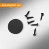 A black circular anti-slip EVA pad and several black screws on a light gray background. Produktbild-Vorschau