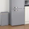 A grey retro-style trash can is placed next to a grey retro-style refrigerator. Podgląd zdjęcia produktu
