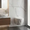 A modern bathroom with a wall-mounted toilet and a sink. Podgląd zdjęcia produktu