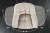A top-down view of a beige bouclé chair, with a faded grey outline indicating its 180-degree rotation capability. Produktbild-Vorschau