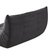 A close-up view of the tufted backrest of a dark gray sofa or chair. Produktbild-Vorschau