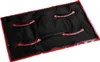 A black rectangular cushion with red straps, presented on a white background. Produktbild-Vorschau