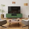 A living room scene with a TV stand, TV, chairs, coffee table, and a floor lamp. Podgląd zdjęcia produktu