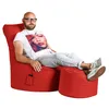 A man is sitting on a red beanbag chair with his feet up on a red ottoman, listening to music with earbuds. Produktbild-Vorschau
