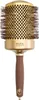 A professional studio shot of a round hairbrush against a white background. Anteprima dell’immagine prodotto