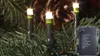Close-up of LED lights on a Christmas tree with a battery pack. Produktbild-Vorschau