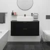 A modern black bathroom vanity with a white sink and a round mirror above it, set against a white tiled wall. Anteprima dell’immagine prodotto