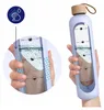 A person is holding a water bottle with time markings on it, showing how much water to drink throughout the day. A close-up inset shows the water level and markings. Náhľad obrázku produktu