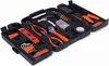 A black tool kit with orange accents, open and displaying various tools. Anteprima dell’immagine prodotto
