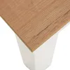 A close-up view of the corner of a table with a wood-grain top and a white base. Produktbild-Vorschau