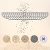 A diagram showing a cat litter box grate with various types of cat litter falling through it, and examples of different cat litters at the bottom. Anteprima dell’immagine prodotto