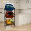 A three-tier storage rack filled with bottles and produce in a kitchen setting. Produktbild-Vorschau