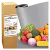 A product shot of an anti-slip mat with a variety of fruits and vegetables, along with its packaging. Produktbild-Vorschau