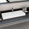 A modern bathroom sink with a faucet and accessories. Podgląd zdjęcia produktu