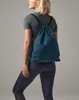 A person wearing athletic clothing and a teal gym bag. Produktbild-Vorschau