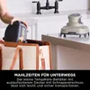 A person is placing a food container into a tote bag next to a kitchen counter with a small appliance on it. Anteprima dell’immagine prodotto