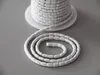 A white cord with a textured pattern is coiled on a gray surface, with a spool of the same cord in the background. Produktbild-Vorschau