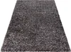 A shaggy rug is shown from a diagonal, slightly elevated angle against a white background. Podgląd zdjęcia produktu