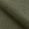 Close-up of a textured green fabric. Produktbild-Vorschau