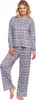 A woman is standing and modeling a gray pajama set with a Nordic-inspired pattern. Produktbild-Vorschau