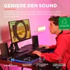 A person is using a computer setup with speakers and a monitor, with ambient pink lighting. Produktbild-Vorschau