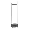 A black metal coat rack with a circular base and wheels, standing against a white background. Podgląd zdjęcia produktu