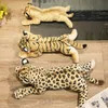 Three plush toy wild cats (lion, tiger, leopard) lying on a wooden floor. Náhled obrázku produktu