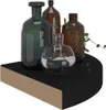 A collection of glass bottles and a plant on a shelf. Produktbild-Vorschau