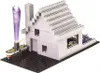 A LEGO-like construction toy set with a house and electronic components. Podgląd zdjęcia produktu