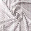 A close-up, top-down view of a white fabric with a small pink and green floral pattern. Náhled obrázku produktu