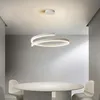 A modern dining room with a round marble table and white chairs, illuminated by a contemporary LED pendant light. Produktbild-Vorschau
