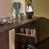 A close-up of a wooden shelf unit with decorative items. Produktbild-Vorschau
