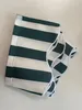 A folded striped fabric product on a white background. Produktbild-Vorschau