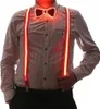 A person wearing a striped shirt, suspenders, and a bow tie. Produktbild-Vorschau