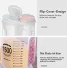A split image showing the top of a food storage container with a flip-top lid and a close-up of the container's measurement markings and contents. Produktbild-Vorschau