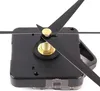 A close-up shot of a black quartz clock movement with black clock hands and a gold nut. Produktbild-Vorschau