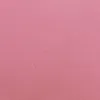 A close-up, flat lay image of a pink bedsheet. Produktbild-Vorschau