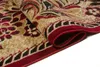 A close-up view of a rolled-up rug with a floral pattern. Náhled obrázku produktu