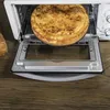 A close-up shot of a baked good inside a toaster oven. Produktbild-Vorschau