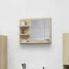 A bathroom mirror cabinet with shelves mounted on a tiled wall. Voir les images du produit