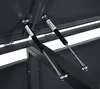 Close-up view of gas struts on a dark gray metal storage box. Náhled obrázku produktu