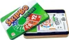 A Skip-Bo Deluxe card game in a metal tin, with the lid open showing the contents. Produktbild-Vorschau