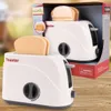 A toy toaster with pop-up toast, displayed in its packaging and also separately on a wooden surface. Anteprima dell’immagine prodotto