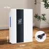 A white and black dehumidifier is shown on a wooden floor with a plant in the background. Anteprima dell’immagine prodotto