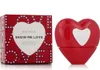 A product shot of Escada Show Me Love Eau De Parfum, including the perfume bottle and its packaging. Produktbild-Vorschau