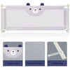 A collage of images showing a baby bed rail with a cartoon bear design, its mesh material, and its foldable base. Produktbild-Vorschau