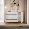 A white high-gloss dresser with gold legs and a marble-look top, displayed in a well-lit room with curtains and artwork. Produktbild-Vorschau